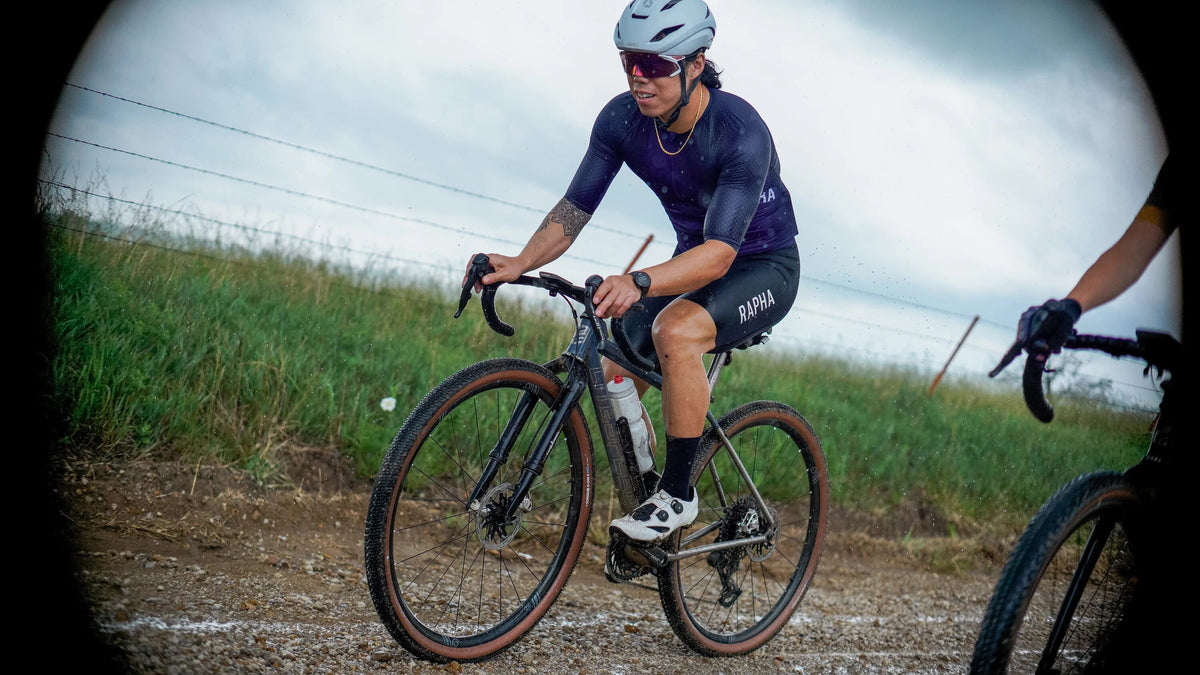 Cyclist on a gravel road with a scenic background